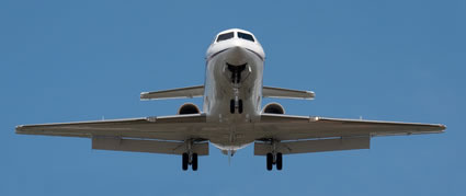 Photo of aeroplane landing at airport